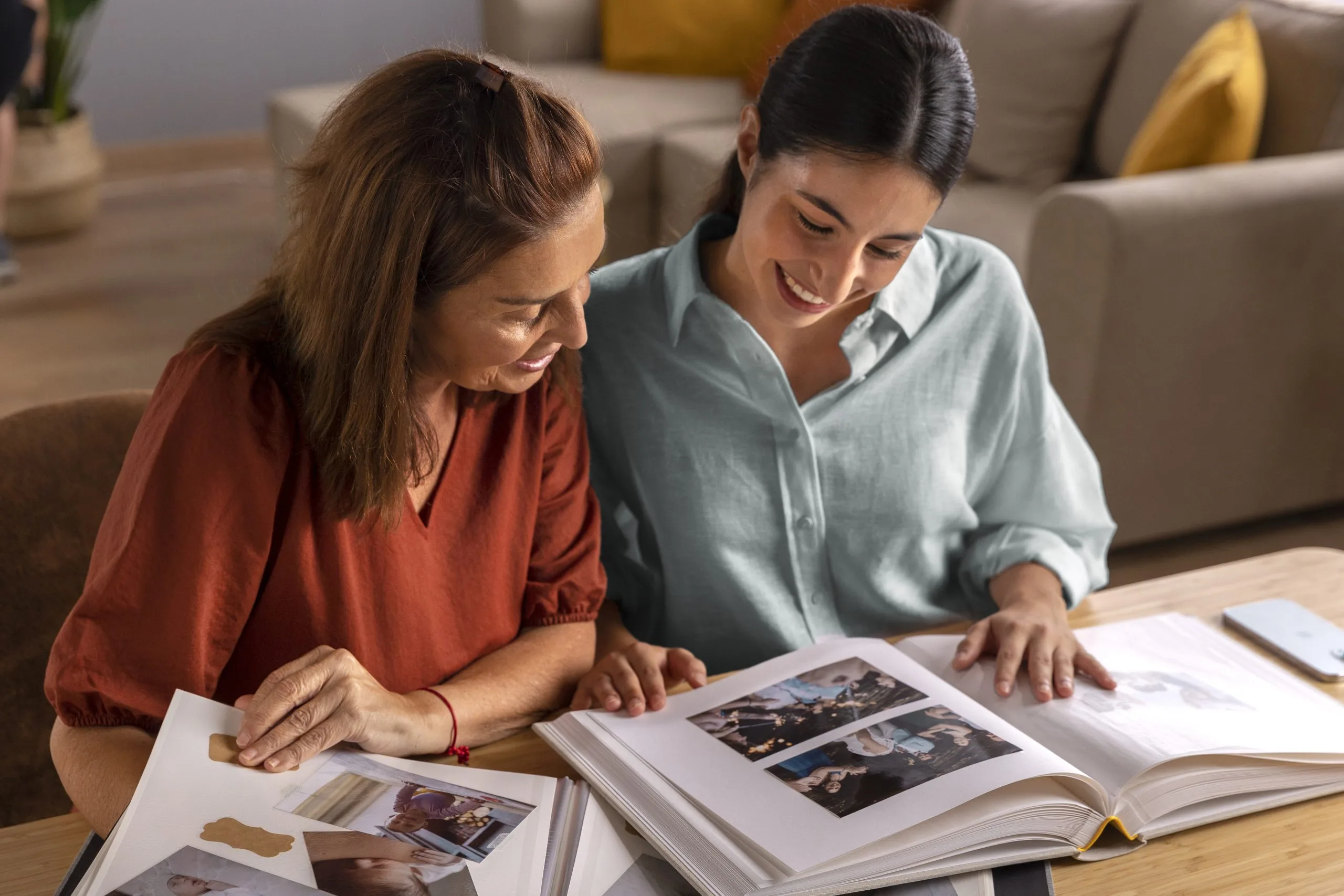 high-angle-women-with-picture-albums