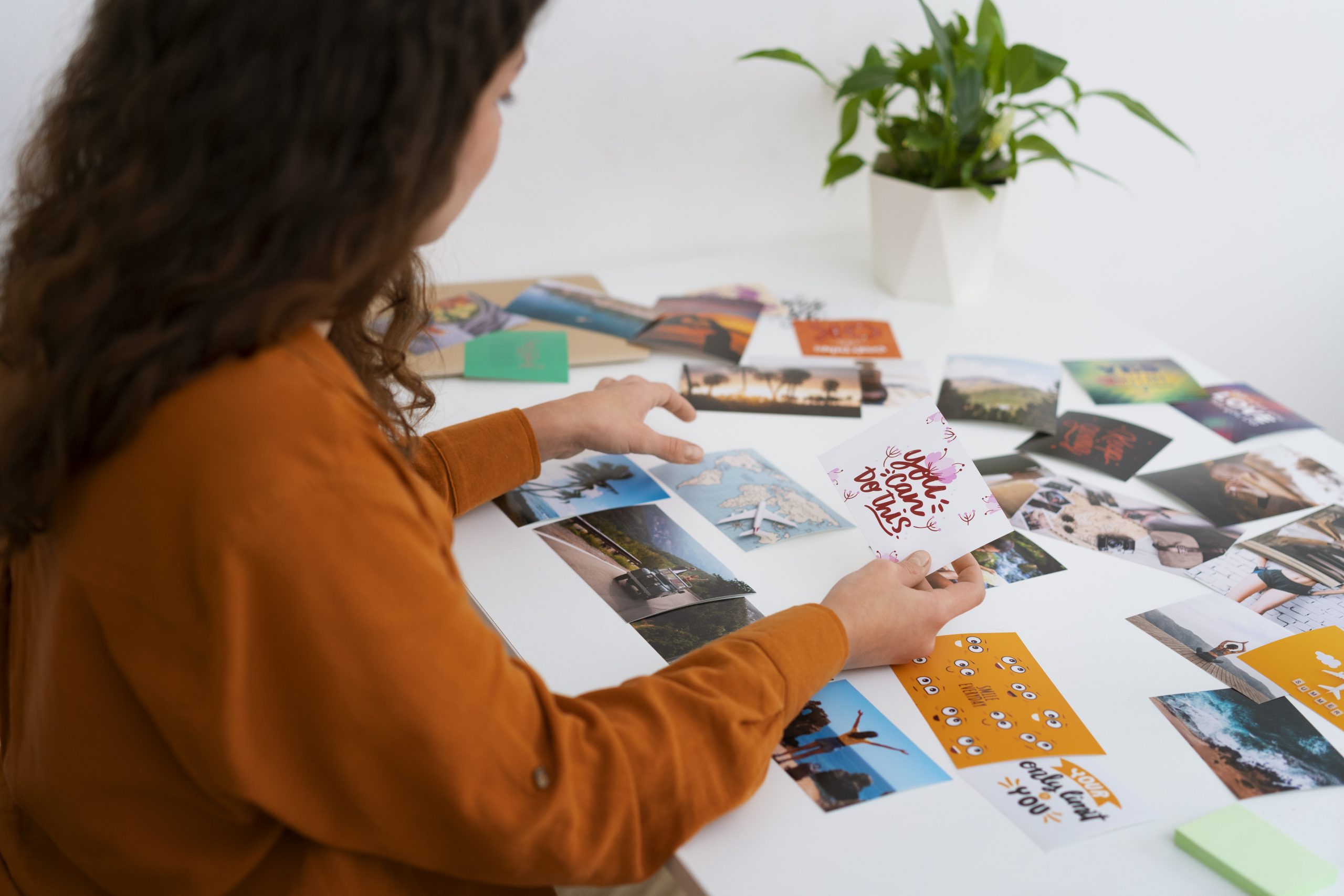 woman-creating-inspiring-vision-board-side-view